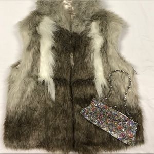Faux fur hooded vest.